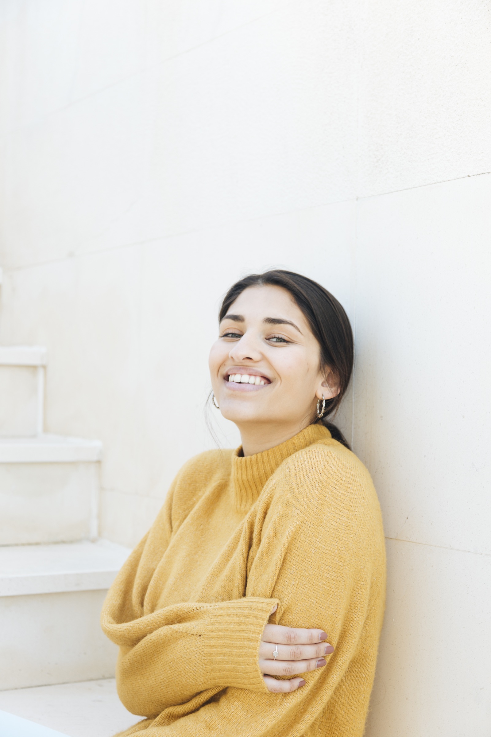 Woman smiling during a quiet moment in her health journey